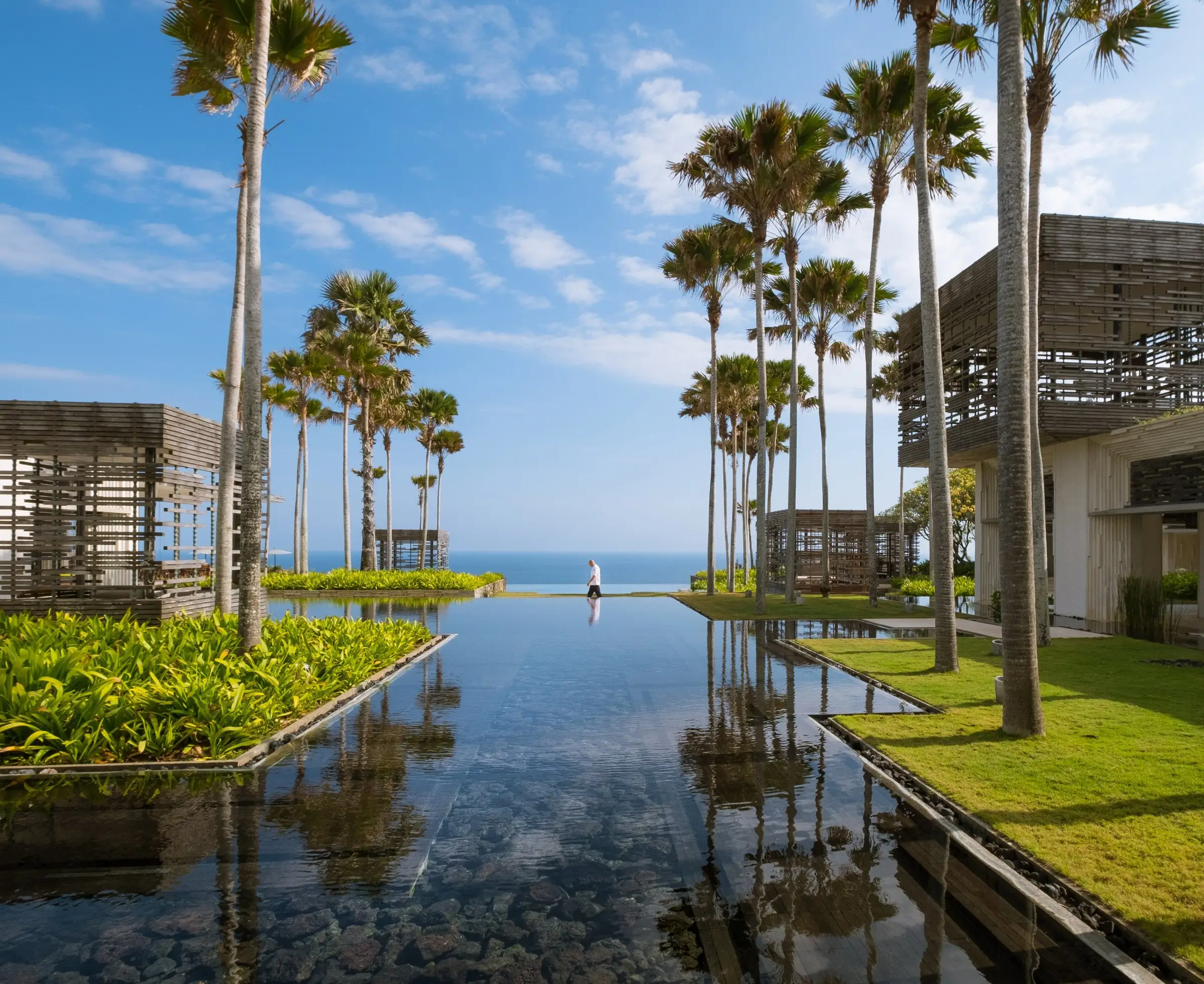 Reflecting pool and lawn leading to the ocean